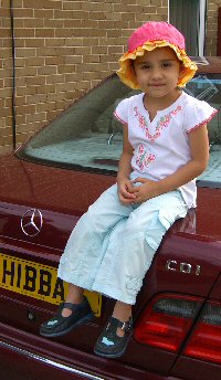 Picture of Hibba, after whom Hibba's Toys is named, infront of her father Waheed Ahmed's car. Click here for a full-size version of this photo