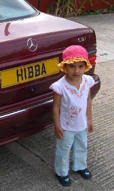 Picture of Hibba, after whom Hibba's Toys is named, infront of Waheed Ahmed's car. Click here for a full-size version of this photo
